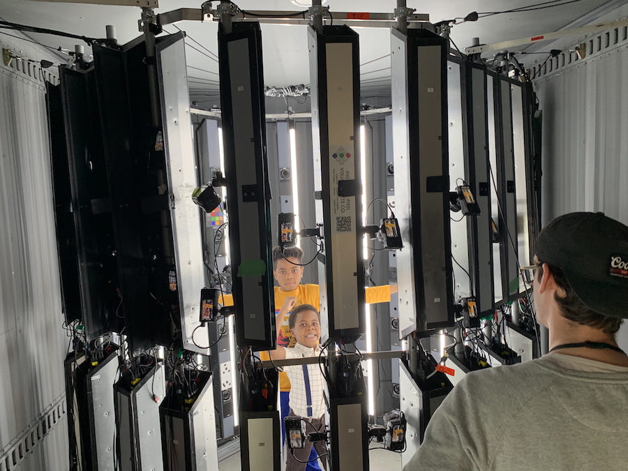 Jayden and Christian in a giant photogrammetry camera, having fun striking a pose.