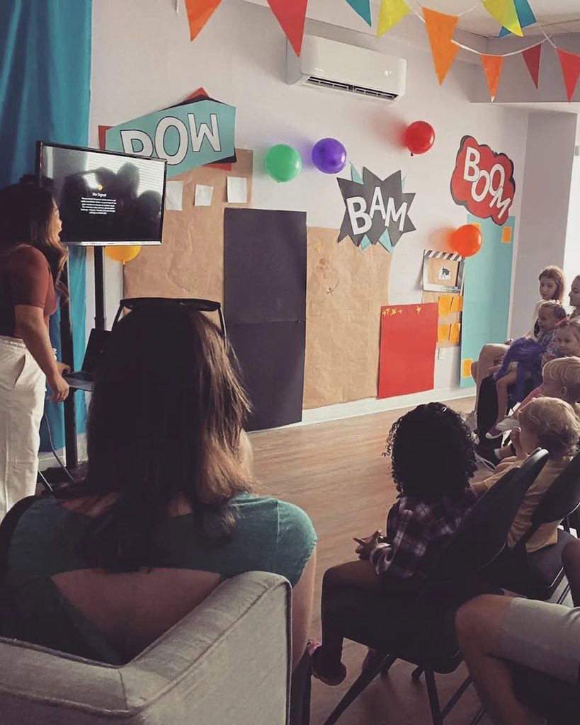 Jennifer teaching a class of young actors.